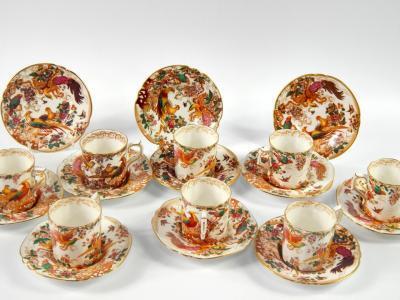 A group of eight Royal Crown Derby demi tasse coffee cans