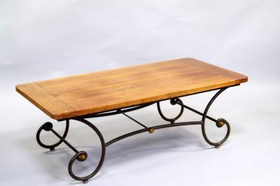 A Roman style chestnut plank top occasional table