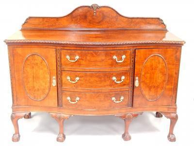 A walnut serpentine sideboard