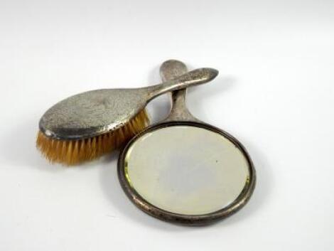 A George V silver backed hand mirror and hair brush