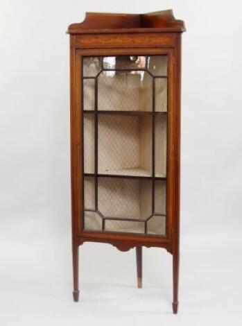 An Edwardian mahogany and satinwood inlaid corner display cabinet