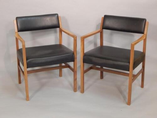 A pair of R Foster & Sons Retro walnut open armchairs