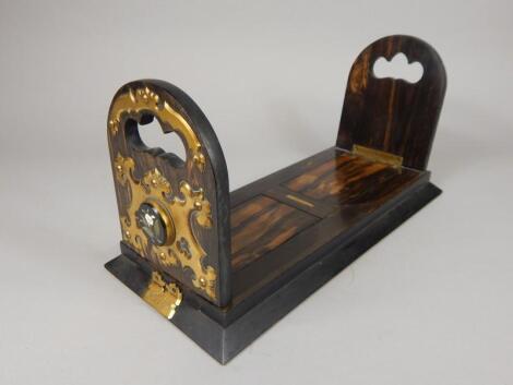 A Betjeman's patent calamander and gilt brass mounted book slide