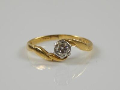 An 18ct gold diamond twist ring