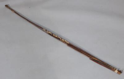 Tribal Art. An African bow with various arrows