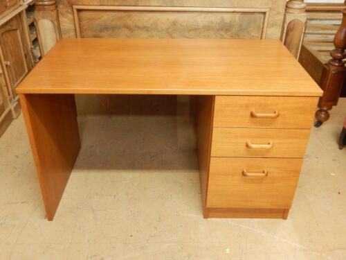 A retro style teak kneehole desk