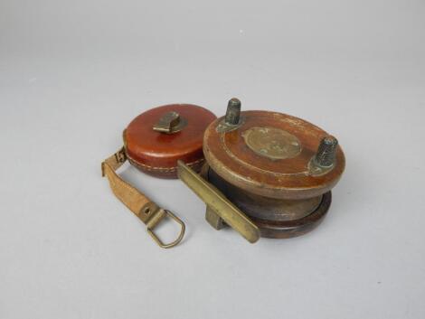 A mahogany and brass mounted fishing reel