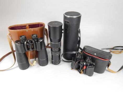 A Vivitar Telephoto lens and two pairs of binoculars