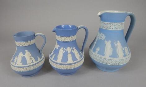 An associated graduated set of three Wedgwood Jasperware jugs