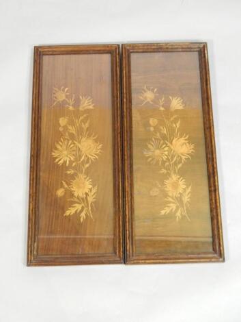 A pair of early 20thC walnut and marquetry panels