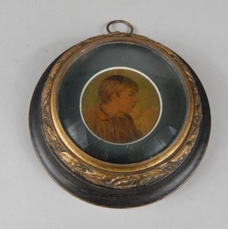 A late 19thC/early 20thC miniature portrait of a young boy