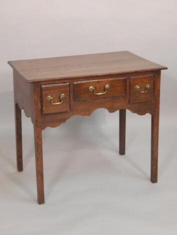 An early 19thC oak lowboy