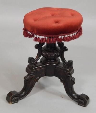 A Victorian ebonised piano stool