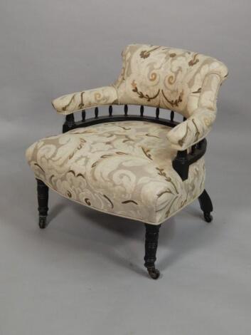 A Victorian ebonised tub shaped chair