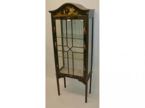 An early 20thC black lacquered display cabinet