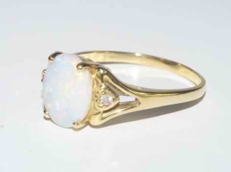 An opal and diamond ring