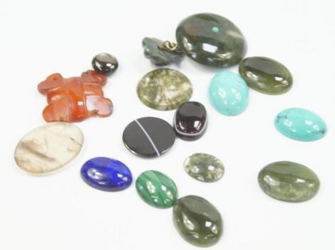 A small selection of agate and hard stone cabochons and slices.