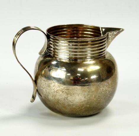 A George V silver milk jug