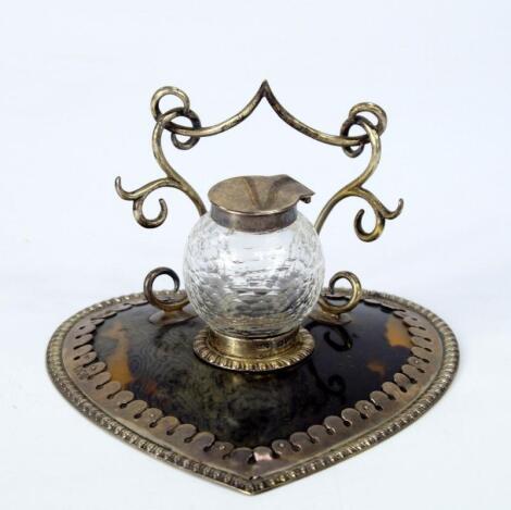 An Edwardian ladies heart shaped tortoiseshell and silver desk stand