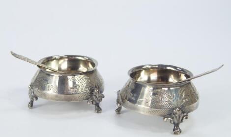 A pair of Victorian silver circular salts
