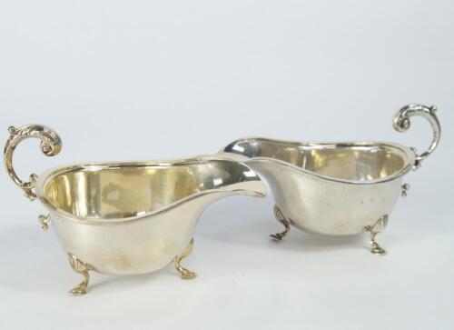 A pair of George VI silver sauce boats