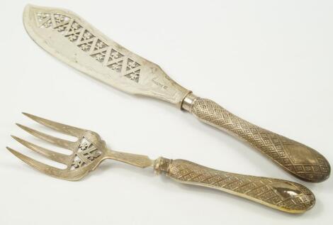 A pair of Victorian silver fish servers
