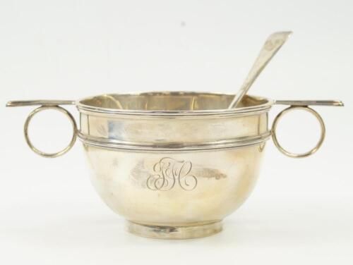 A George V silver twin handled bowl and spoon