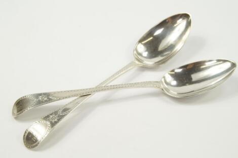 A pair of George III silver serving spoons