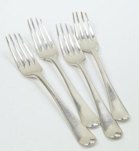 A set of four George III silver table forks