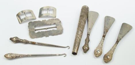 A group of Victorian and later silver handled shoe horns