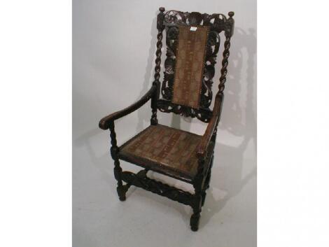 An 18thC walnut open armchair