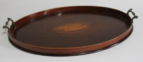 A 19thC Sheraton mahogany oval serving tray