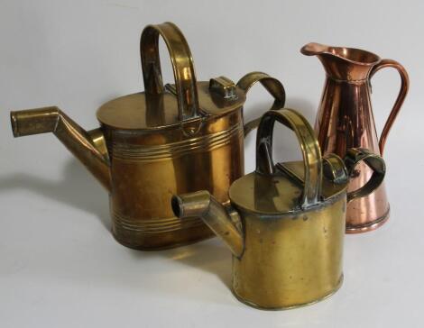 Two brass watering cans