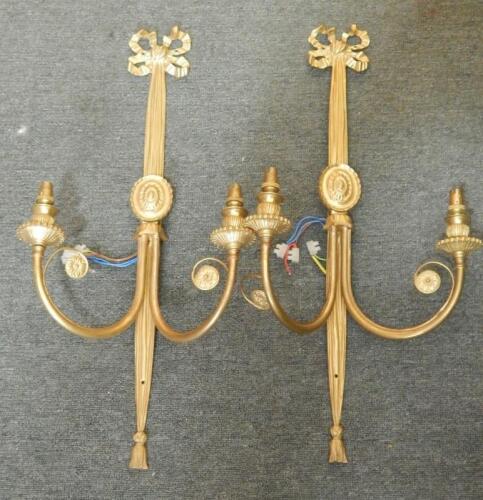 A pair of Sheraton style brass wall lights