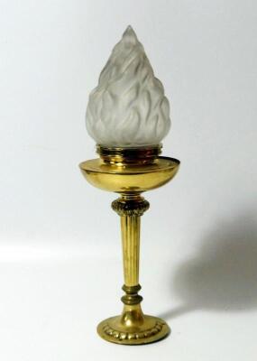 A brass torch form table lamp