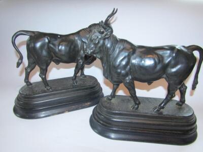 After Charles Valton (1851-1918). A patinated spelter figure of a longhorn bull and a companion fig