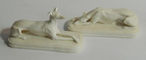 A pair of 19thC Parian models of recumbent greyhounds