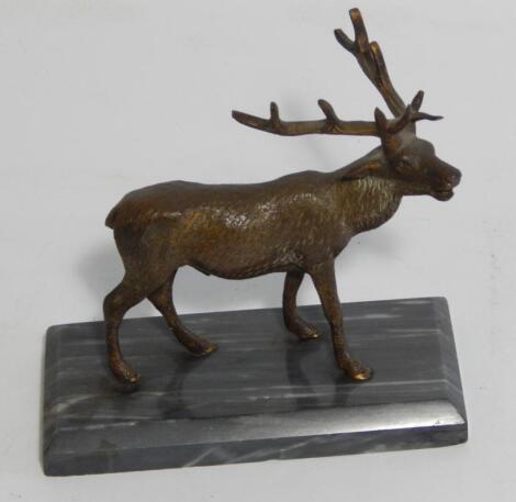 An early 20thC bronze model of a stag in a standing pose