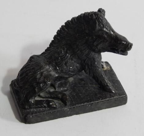 A green carved soapstone model of a boar