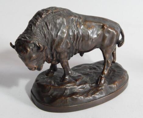 An early 20thC hollow cast bronze model of a standing buffalo