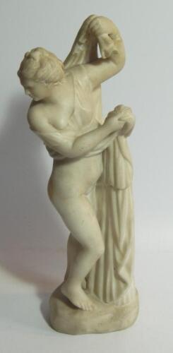 A white marble figure of a classical semi-nude woman