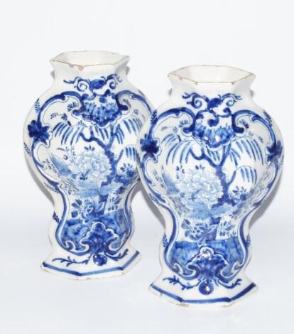 A pair of early 19thC Dutch Delft blue and white tin glazed earthenware vases