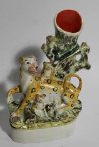 A mid-19thC Staffordshire leopard and cubs spill vase group