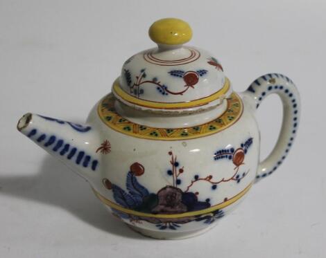 A tin glazed earthenware teapot