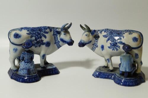 To GR270716. A pair of early 19thC Dutch Delft blue and white milkmaid and cow groups