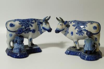 To GR270716. A pair of early 19thC Dutch Delft blue and white milkmaid and cow groups