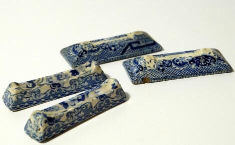 Two pairs of 19thC blue and white pottery knife rests