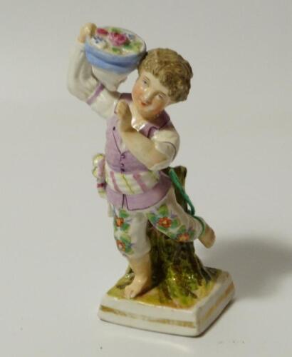 A 19thC Sitzendorf figure of a child