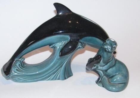 A 20thC Poole Pottery figure of a leaping dolphin