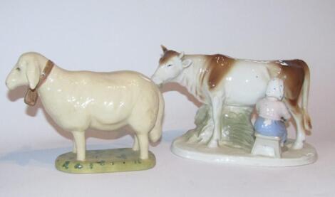 A GDR WA Blue Crown figure of milkmaid and cow